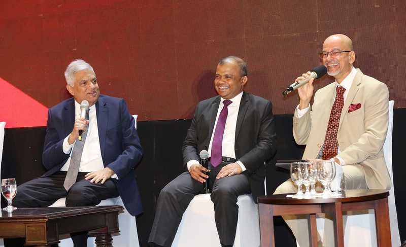 President Ranil Wickremesinghe shares a light moment with CA Sri Lanka President Mr. Sanjaya Bandara and Moderator Mr. Adamaly.