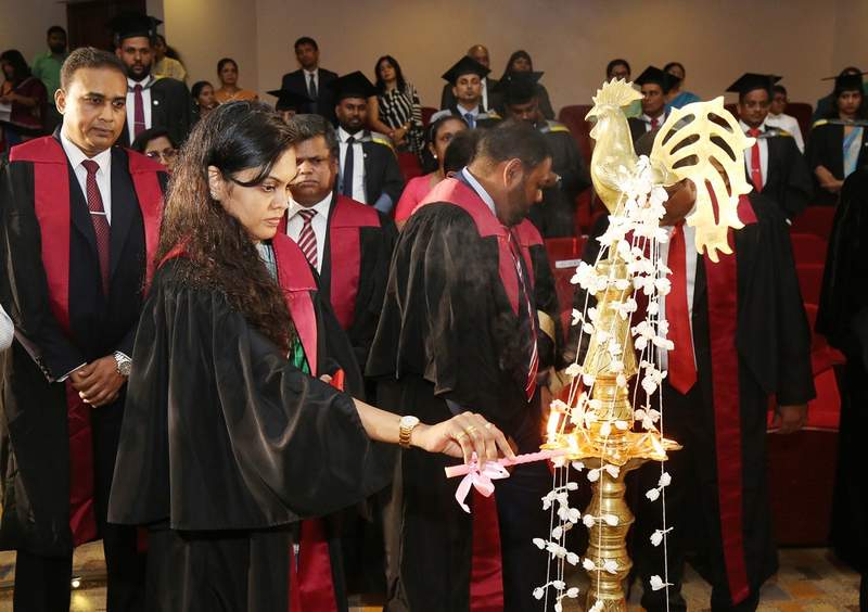 Dr. R.S. Anoma Priyadarshani, Secretary of CA Sri Lanka lighting the traditional oil lamp